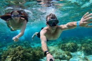 Mellieha: Gozo, Comino, Sea Caves, and Blue Lagoon Cruise - Blue Lagoon in Comino: pass required, crowds managed, and boat time optional